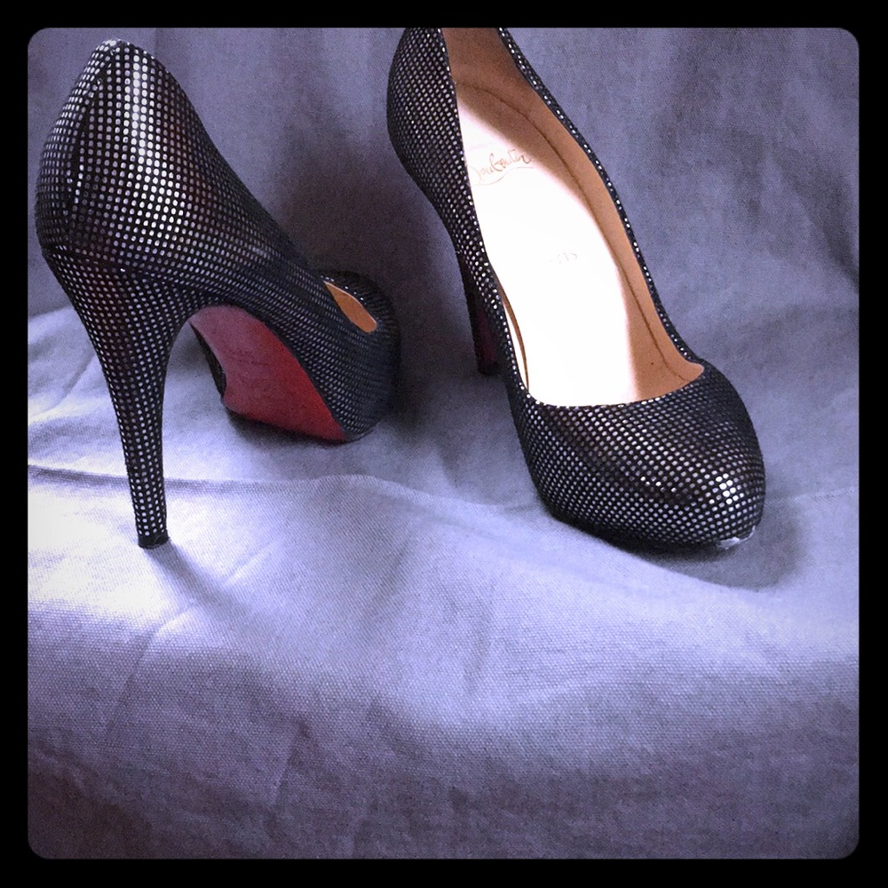 Christian loubotin black and sliver heels.
